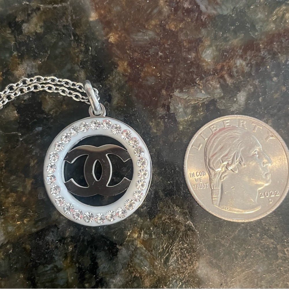 Beautiful designer-inspired pendant necklace- white background w/surrounding CZs